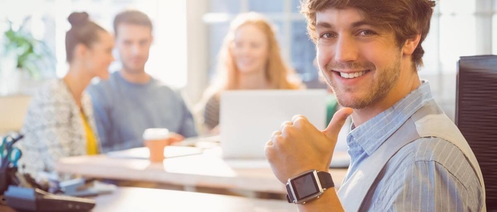 smiling student working at a high tech company